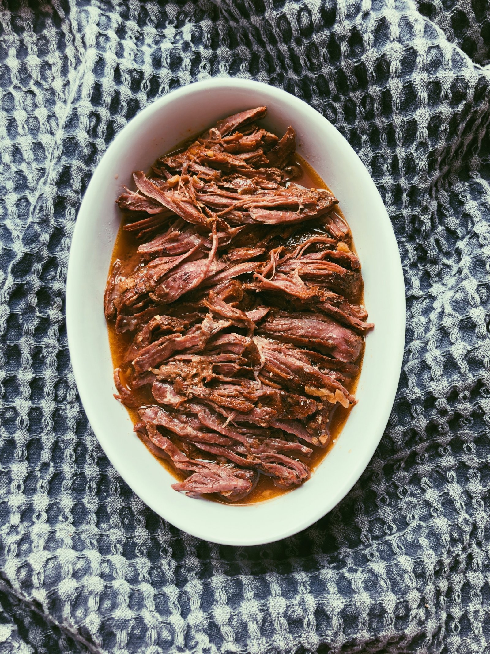 slow cooked tender shredded flank steak