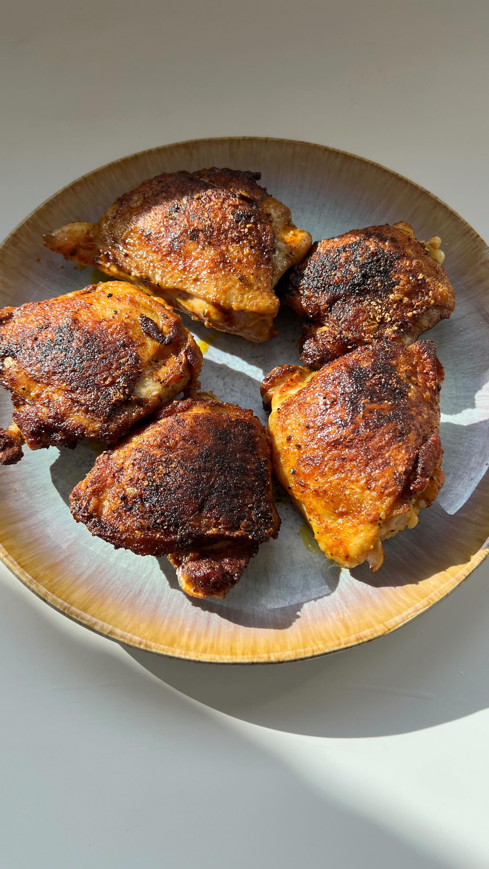 i made this really crispy chicken in a cast iron skillet and then i made a sauce for it to simmer in and serve on top of rice 👌peak cozy meal 👌and it’s a recipe i’m going to perfect in the coming weeks (and i promise it’s more appetizing than it looks lol) and share on my page! the sauce is kinda like a cross between butter chicken and nigerian stew 🤷‍♀️